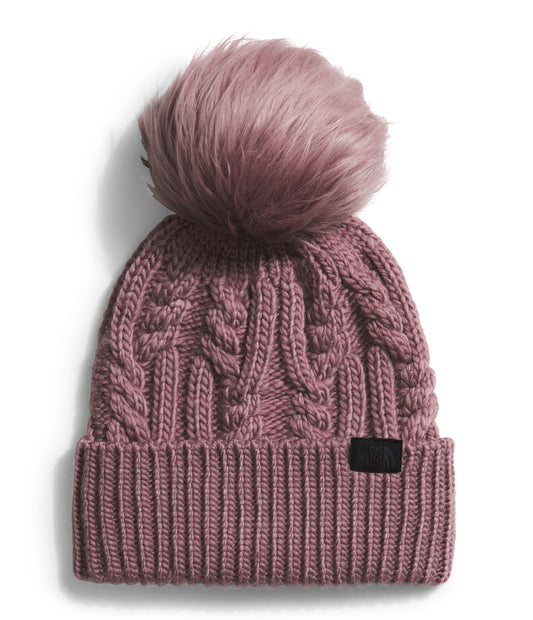 Knitted beanie with a faux fur pompom.