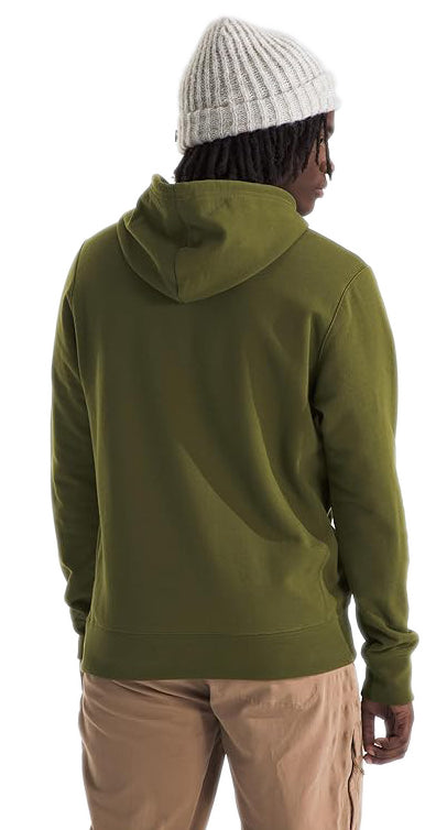 Man wearing olive green hoodie and light brown pants, rear view.