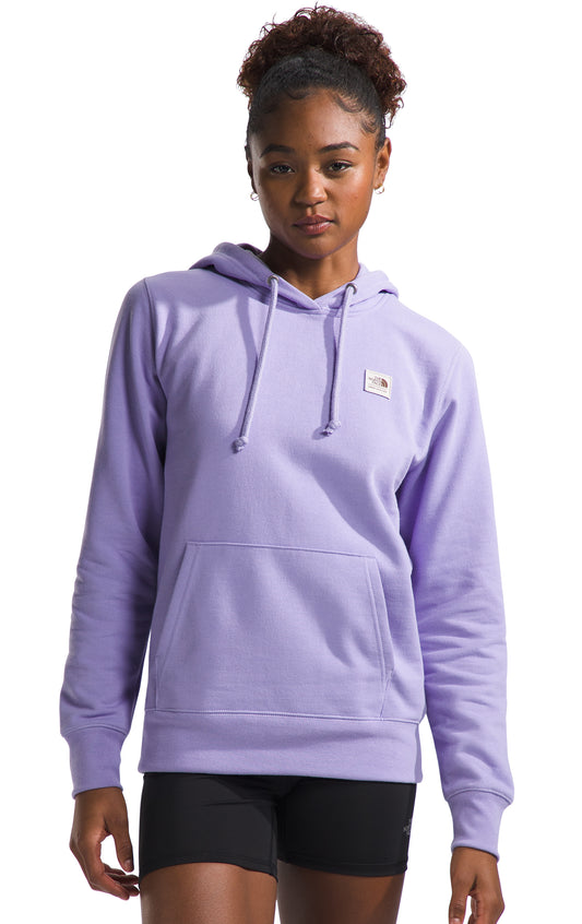 Person wearing a long-sleeved purple hoodie with a front pocket and drawstrings.