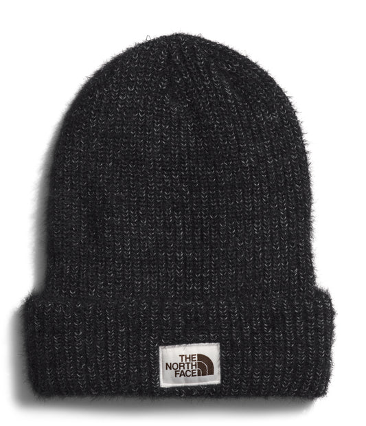 Black knit beanie with a small, rectangular logo patch near the brim.