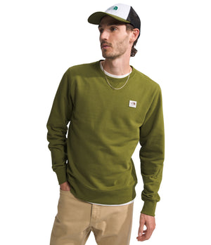 Man wearing olive-green long sleeve shirt, beige pants, and baseball cap.