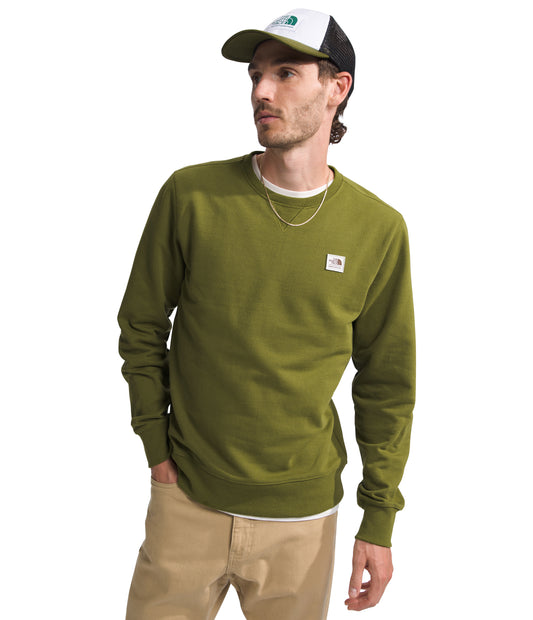 Man wearing olive-green long sleeve shirt, beige pants, and baseball cap.