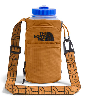 Tan bottle holder with a blue lid featuring an adjustable tan strap adorned with black patterns and THE NORTH FACE logo in black on the pouch.