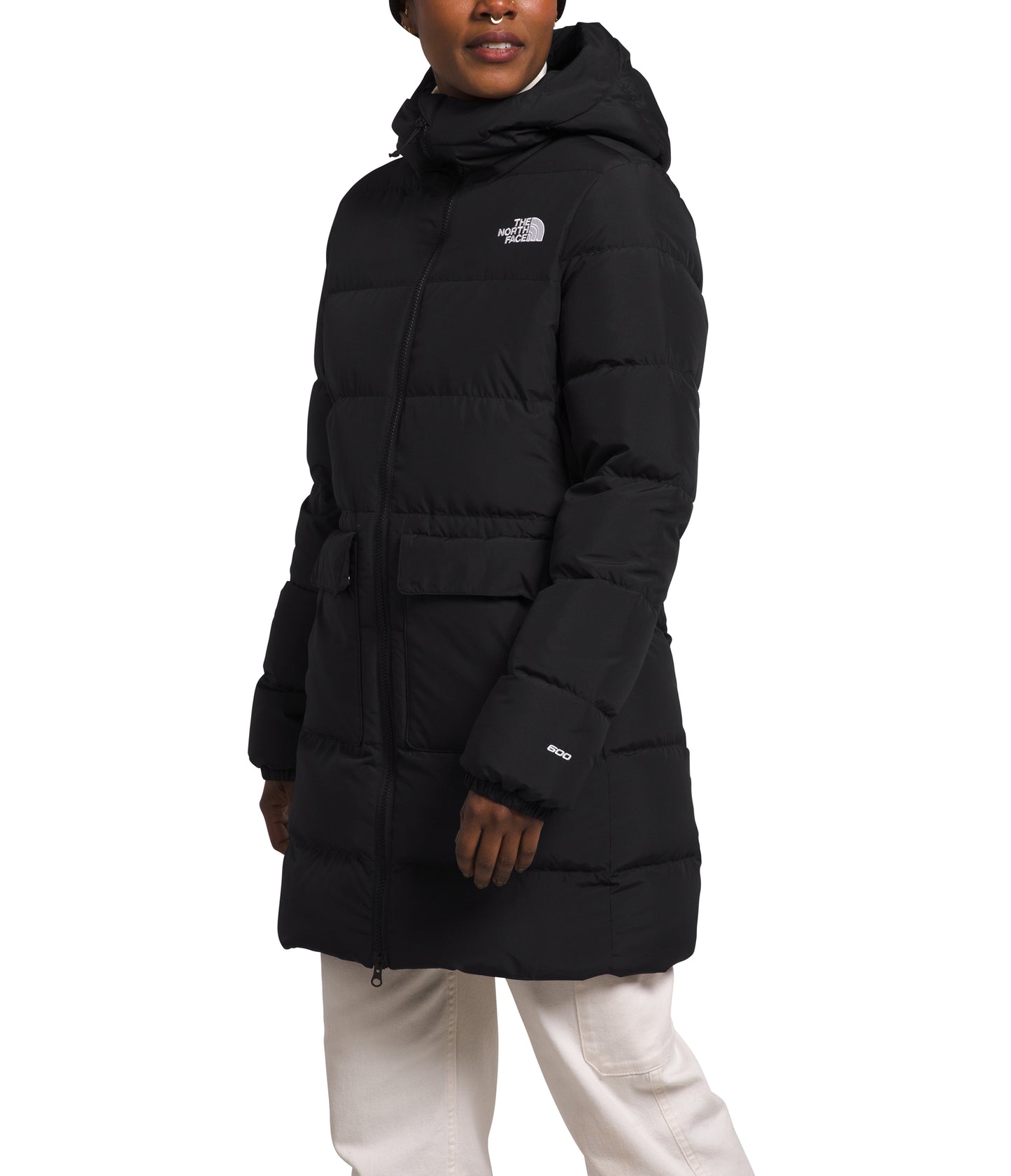 Person wearing a long black puffer jacket with a hood.