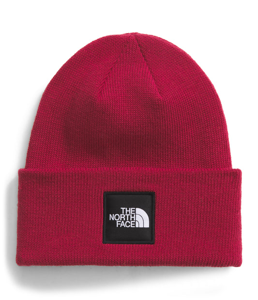 Red beanie with a black patch containing 'THE NORTH FACE' text.