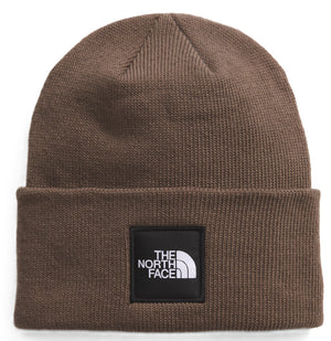 Brown beanie with a black square patch and the text "THE NORTH FACE" in white.