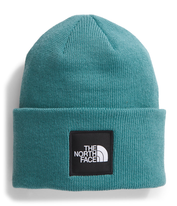 Teal knit beanie with a black square logo patch that reads "THE NORTH FACE" in white.