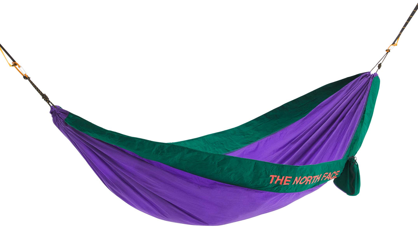 Hanging purple and green hammock with "THE NORTH FACE" logo.