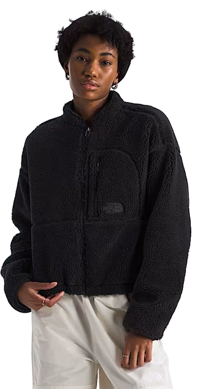A black, long-sleeved, zippered, soft-textured jacket with a breast pocket on a person.