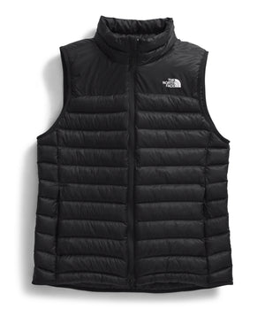 Black, quilted, down filled vest with a high collar and a white logo on the upper right.