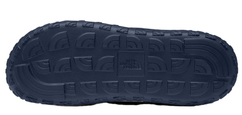 Dark blue shoe sole with a repeating grid pattern of shoe treads and logos.