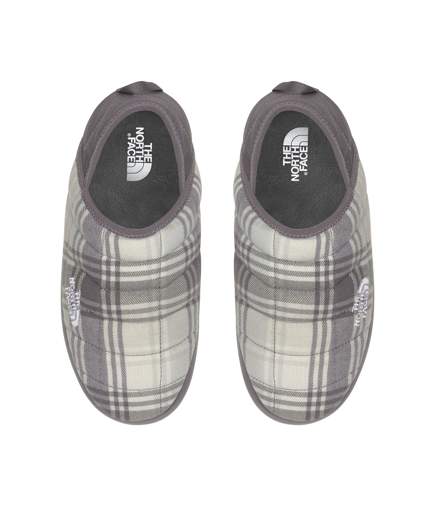 Top-down view of two gray and white plaid quilted slippers with "THE NORTH FACE" logo on the side.