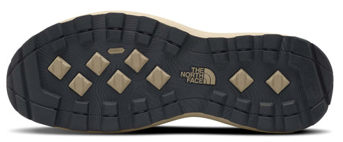 A shoe outsole with a repeating diamond pattern and a logo with the words 'THE NORTH FACE'.