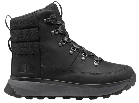 A black, high-top boot with a gray sole, padded ankle, and metal eyelets.