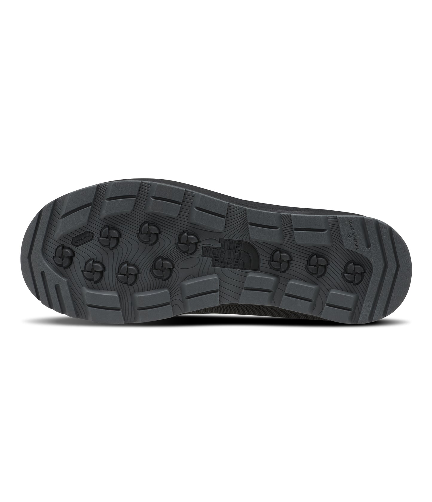 Close-up of a gray boot outsole with a textured pattern of geometric shapes, including circular and rectangular elements.