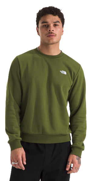 A man wearing a plain green sweatshirt.
