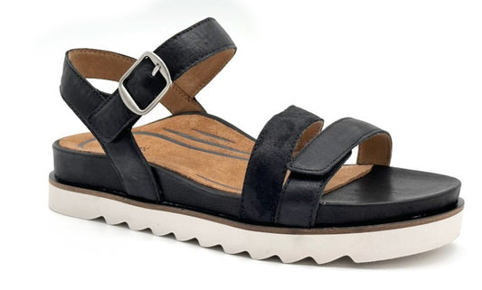 Black sandal with two upper straps, an ankle strap, and a thick white sole.