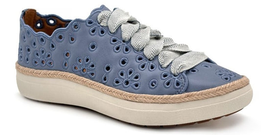 Blue leather sneaker with daisy cutouts, decorative scalloped trim, wide herringbone ribbon laces, and a jute wrapped sole.