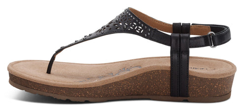 A black T-strap sandal with a tan insole and cork wedge heel.