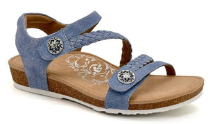 Blue denim sandal with braided straps and decorative silver buttons.