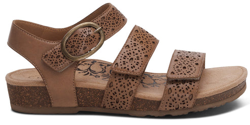 Tan sandal with two velcro straps and an ankle strap.
