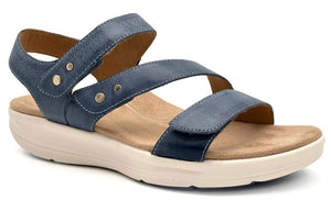 A blue sandal featuring adjustable straps and a beige contoured footbed with a white platform sole.