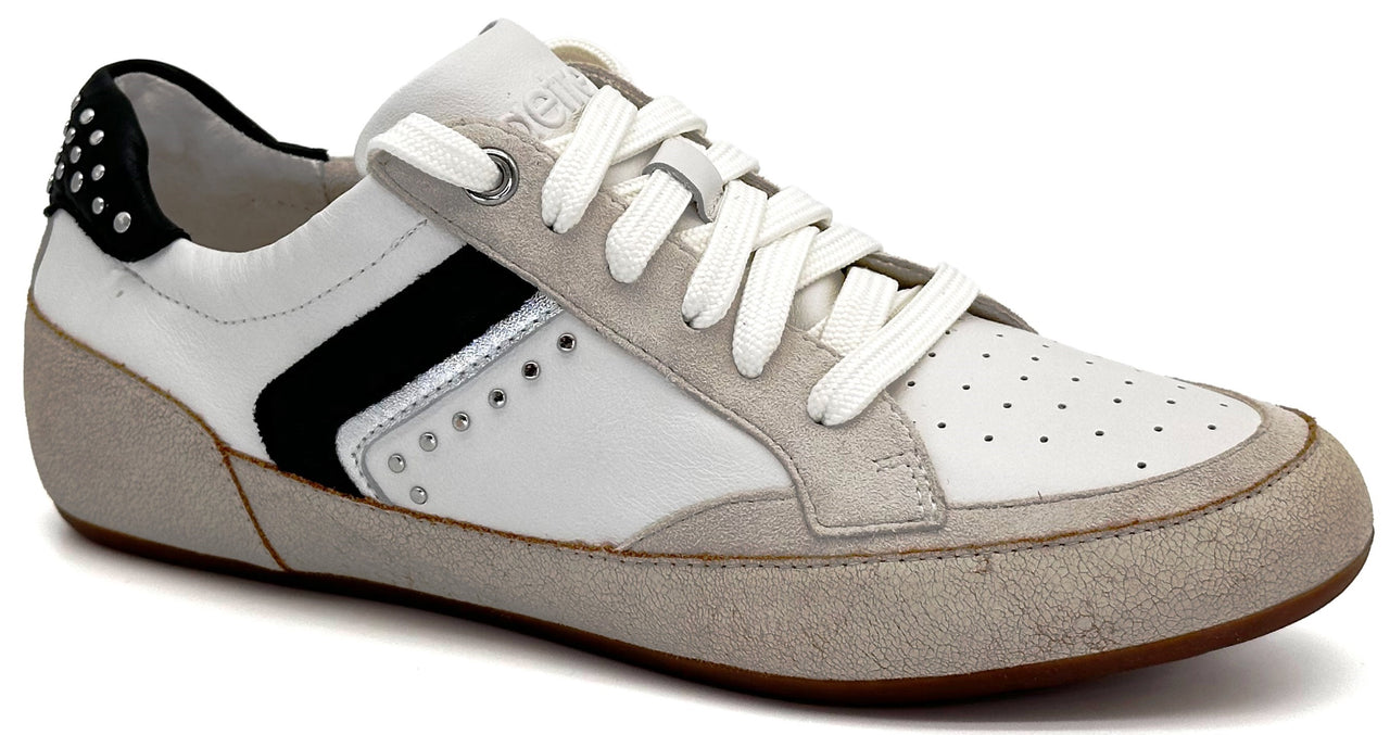 A low-top sneaker with a white leather upper, grey suede overlays at the toe and heel, a black stripe accent, silver studs on the heel and side, and white laces against a plain white background.