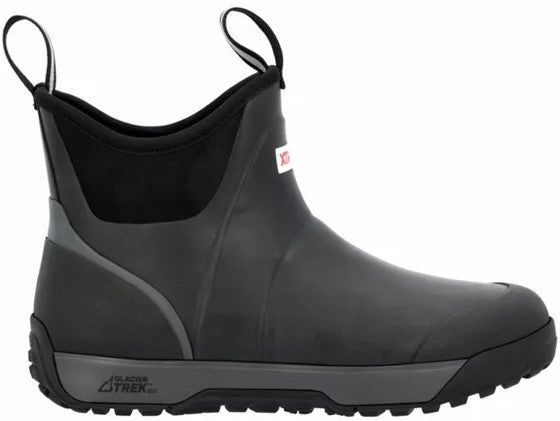 A black ankle-height rubber boot with a grey Glacier Trek Pro midsole, two pull tabs at the top, and a white brand logo tag on the side.