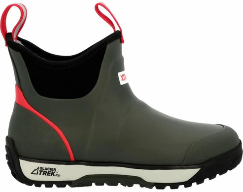 An olive green ankle-height waterproof rubber boot with a black collar, bright red accents, dual red pull tabs, and a cream-colored midsole with a black, rugged outsole, featuring the text "GLACIER TREK" printed on the side of the heel.