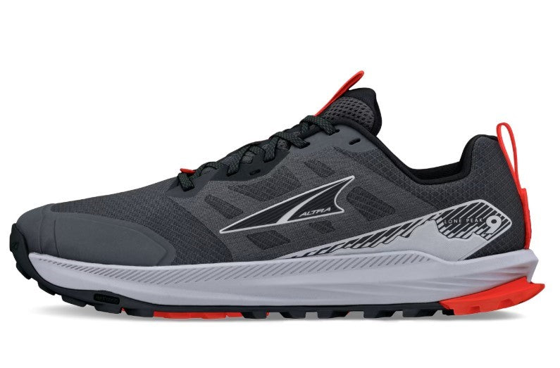A gray and black running shoe with red accents, black laces, and a white midsole.