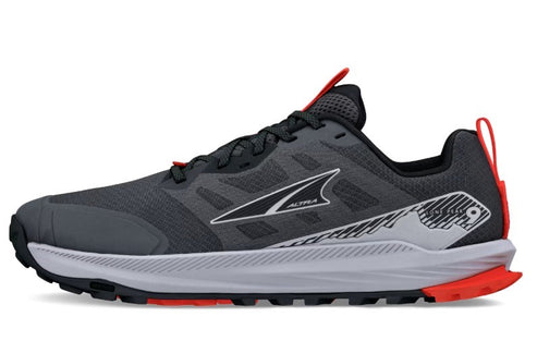 A gray and black running shoe with red accents, black laces, and a white midsole.