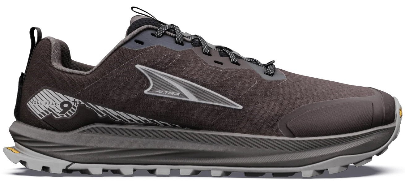 A dark gray Altra Lone Peak 9 trail running shoe from the side view, featuring a lugged light gray outsole, a gray foam midsole, a mesh upper with the brand logo, and a numeric branding on the heel.