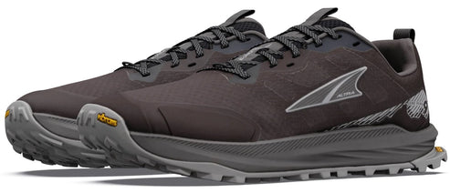 A pair of charcoal-colored trail running shoes with a thick grey sole, Vibram tread, laces, and the brand name Altra printed on the side.