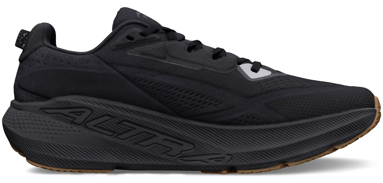 A black running shoe with thick sole.