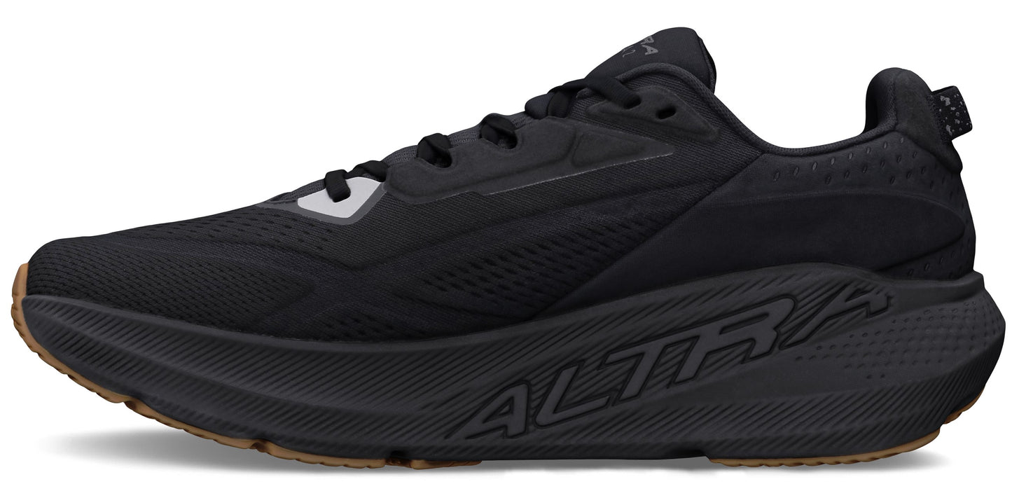 A black athletic shoe with laces and a thick sole.