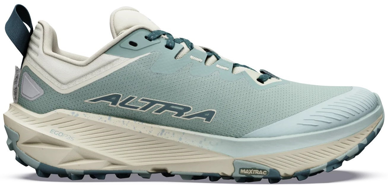 A light blue and beige trail running shoe with a rugged, multi-directional lugged outsole, a thick cushioned midsole with an EGO logo, a perforated mesh upper, and the text ALTRA printed on the side.