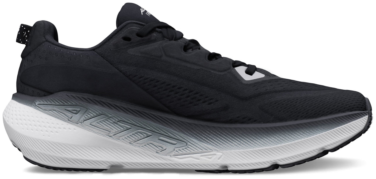 A black athletic shoe with thick white sole.
