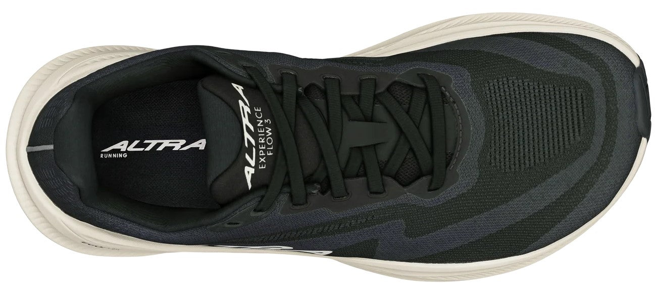 A top-down view of a black running shoe with a light beige midsole and black laces, featuring 'ALTRA' and 'EXPERIENCE FLOW 3' text visible on the tongue.