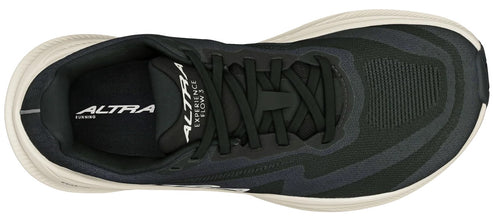 A top-down view of a black running shoe with a light beige midsole and black laces, featuring 'ALTRA' and 'EXPERIENCE FLOW 3' text visible on the tongue.