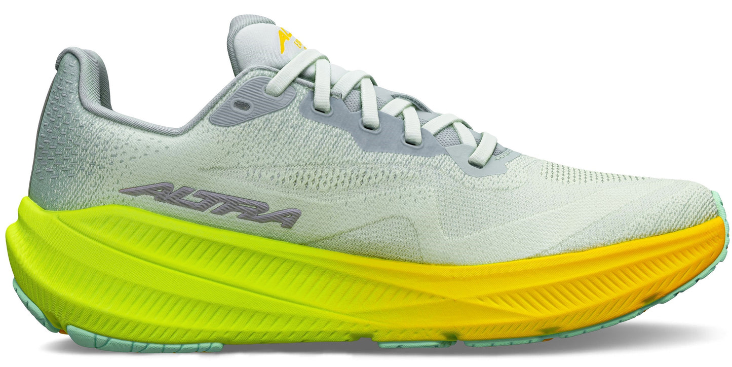A running shoe with a gradient yellow and green sole.