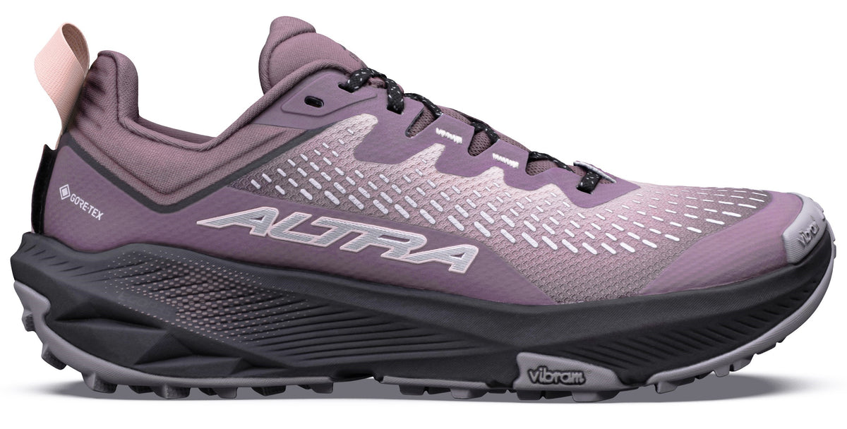 A lateral view of a purple Altra trail running shoe with a dark grey Vibram sole and Gore-Tex branding.