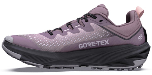 A side view of a mauve-colored trail running shoe with a dark grey, ridged midsole, black patterned laces, and the text GORE-TEX printed on the side.
