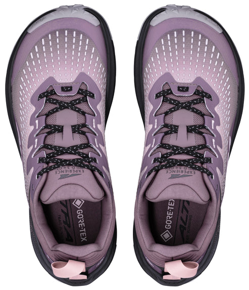 A top-down view of a pair of lavender Altra Experience Wild 3 GTX trail running shoes with black laces, showing the Gore-Tex branding on the insole.