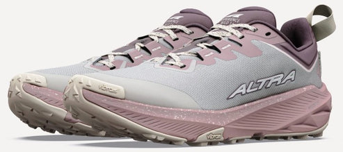 A pair of light gray and dusty rose trail running shoes with rugged Vibram soles, featuring the word ALTRA printed on the side.