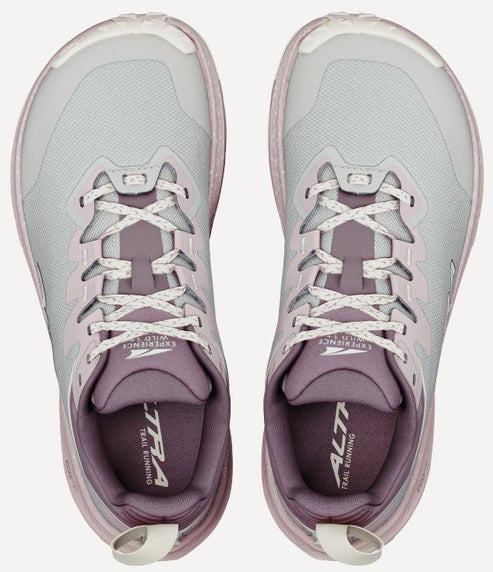 A pair of Altra Experience Wild trail running shoes in light grey and muted mauve, viewed from directly above, showing lace-up closures and branded insoles.