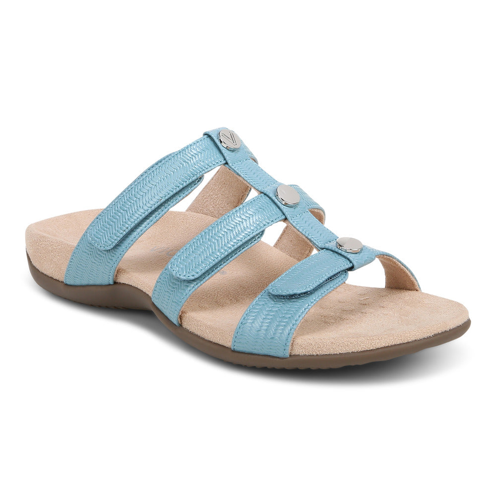 Light blue sandal with three straps and silver hardware.