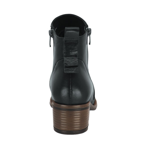 Back view of a black ankle boot with a stacked brown heel and a zipper.