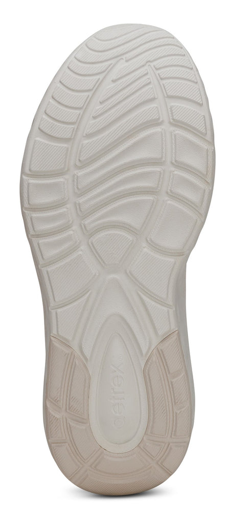 The sole of a shoe with a textured grip pattern.