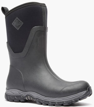 A black mid-calf rubber rain boot featuring a logo patch on the shaft that reads The Original Muck Boot Company, a reinforced toe cap, and a textured grey and black rubber outsole.