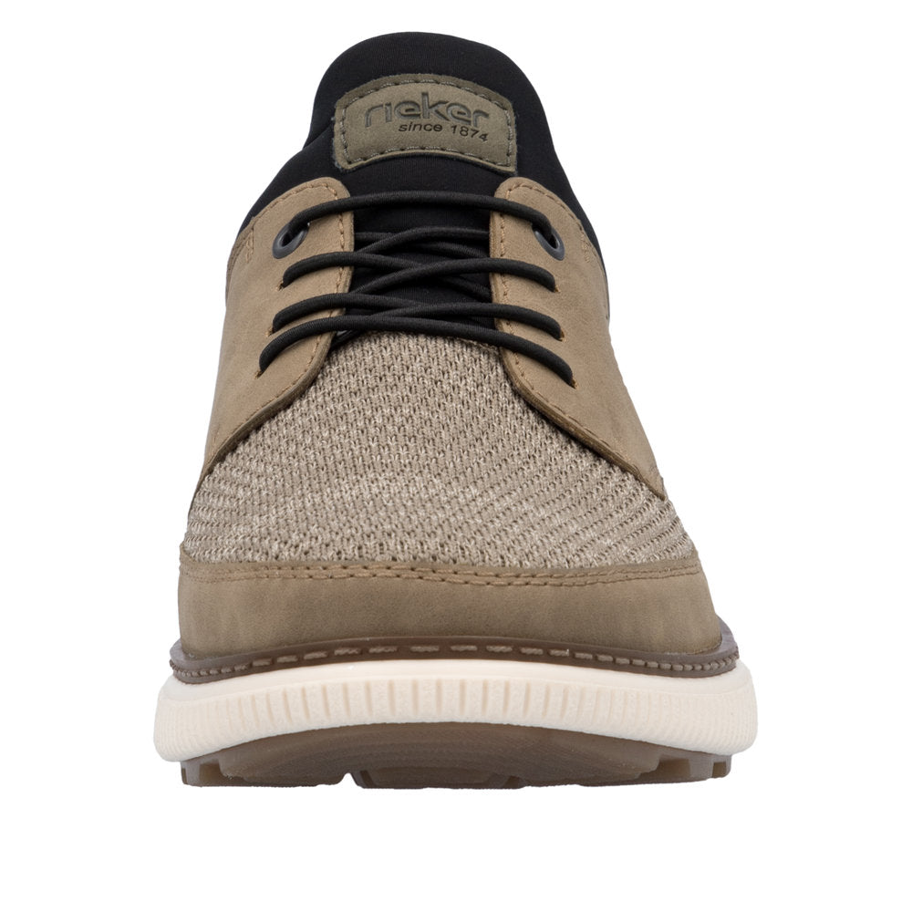 A low cut lace-up shoe with a taupe knit fabric at the vamp, taupe suede leather side panels, a black fabric collar and laces, and a thick white sole; an olive green fabric label at the collar says, "Rieker since 1874".